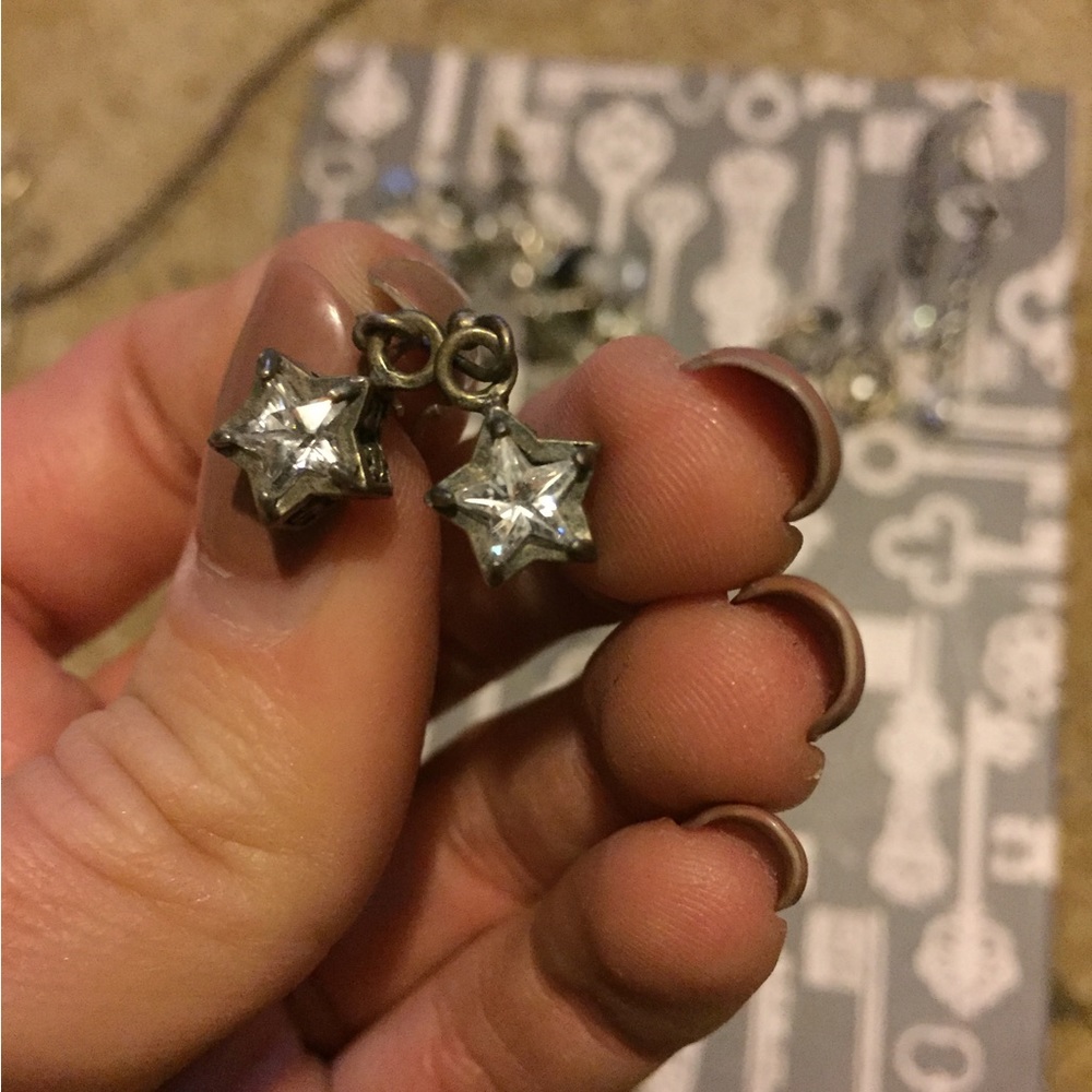 Sterling silver diamond star earrings.